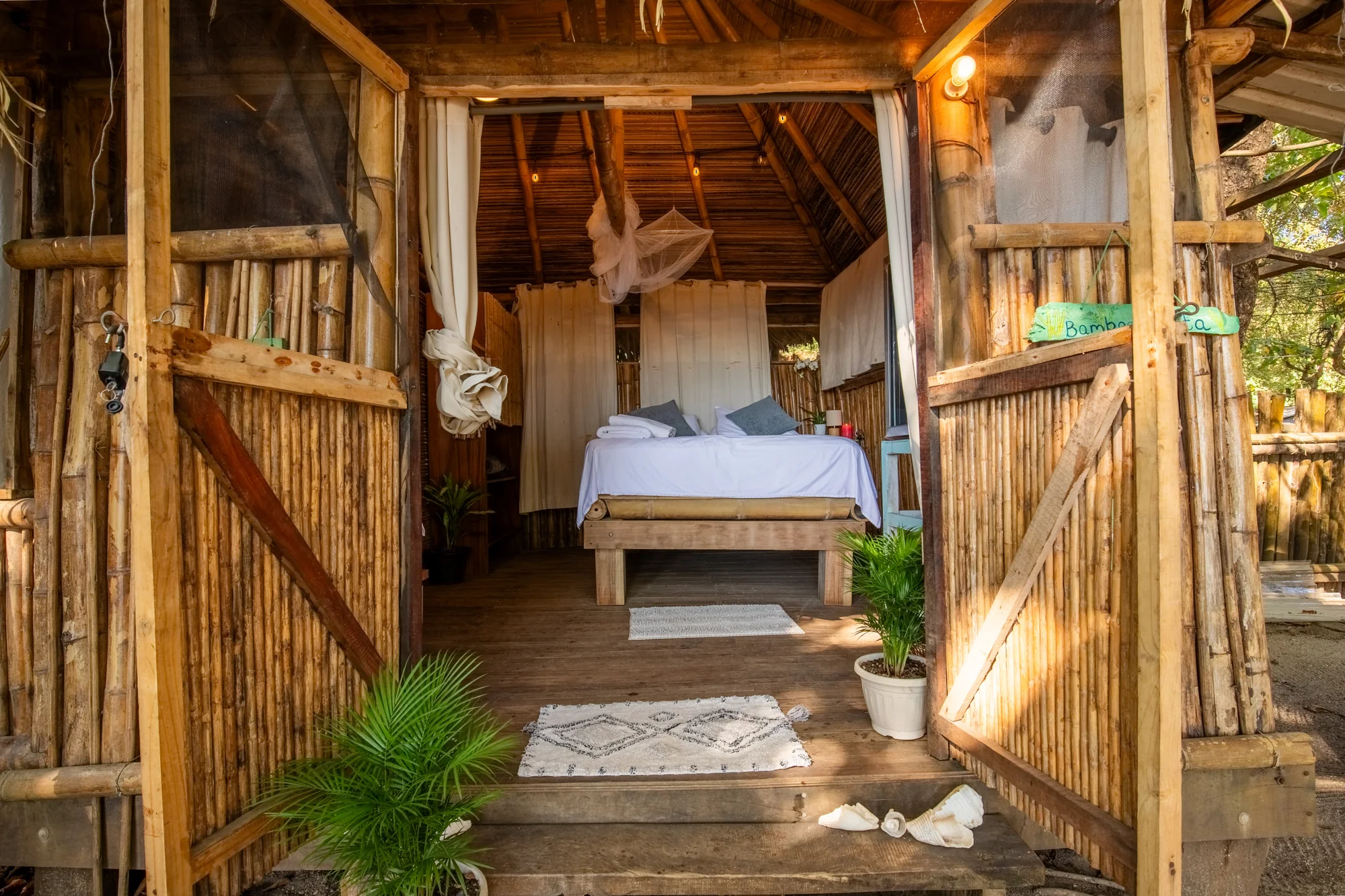 Bamboo Cabina bedroom seen through its open double doors