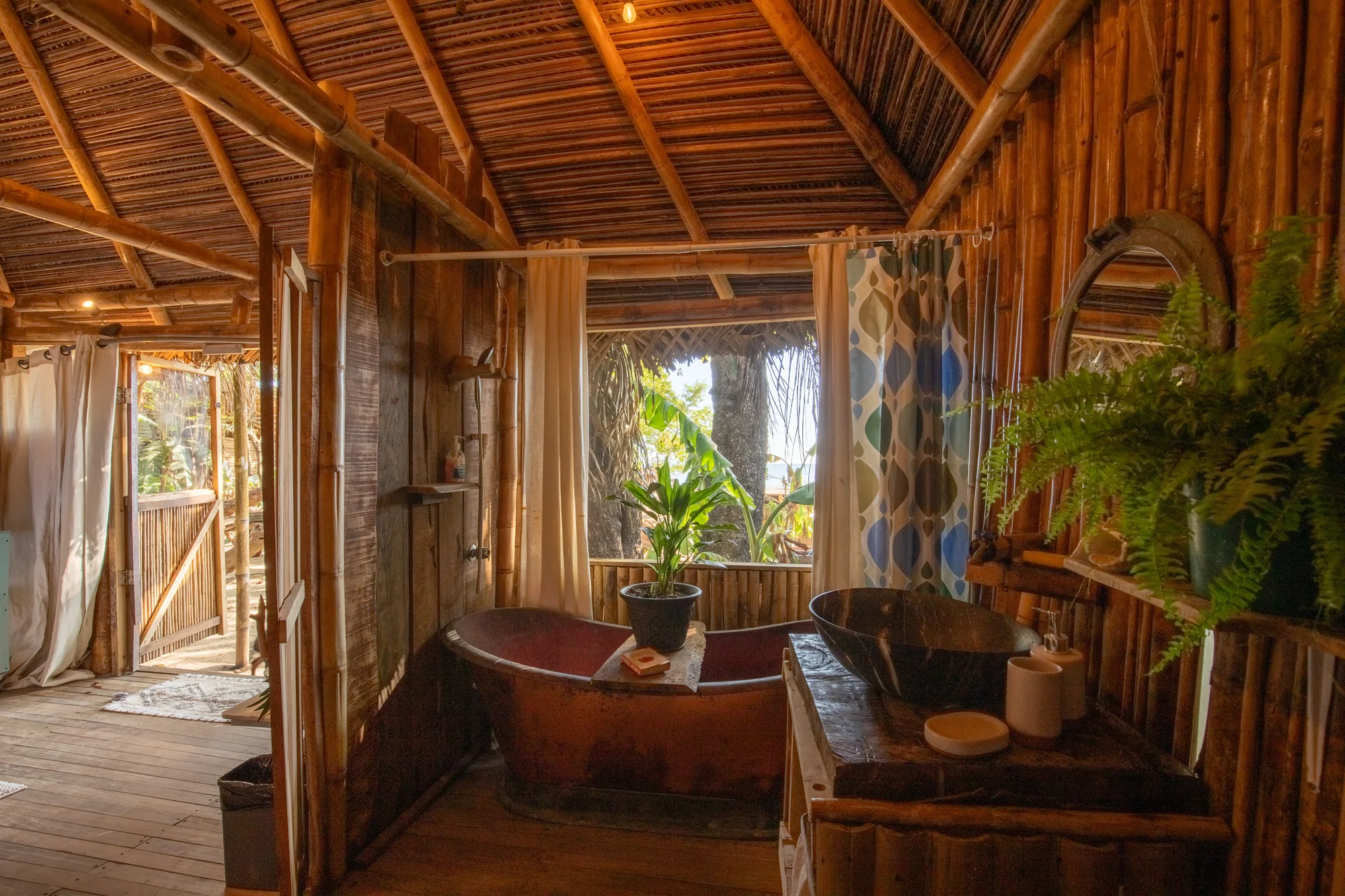 Bamboo-lined bathroom with freestanding bathtub